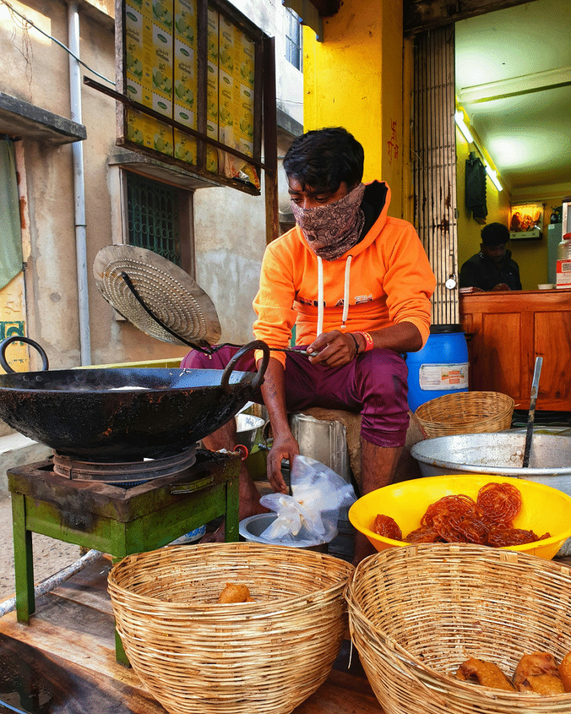 Local shopkeeper making Indian sweets